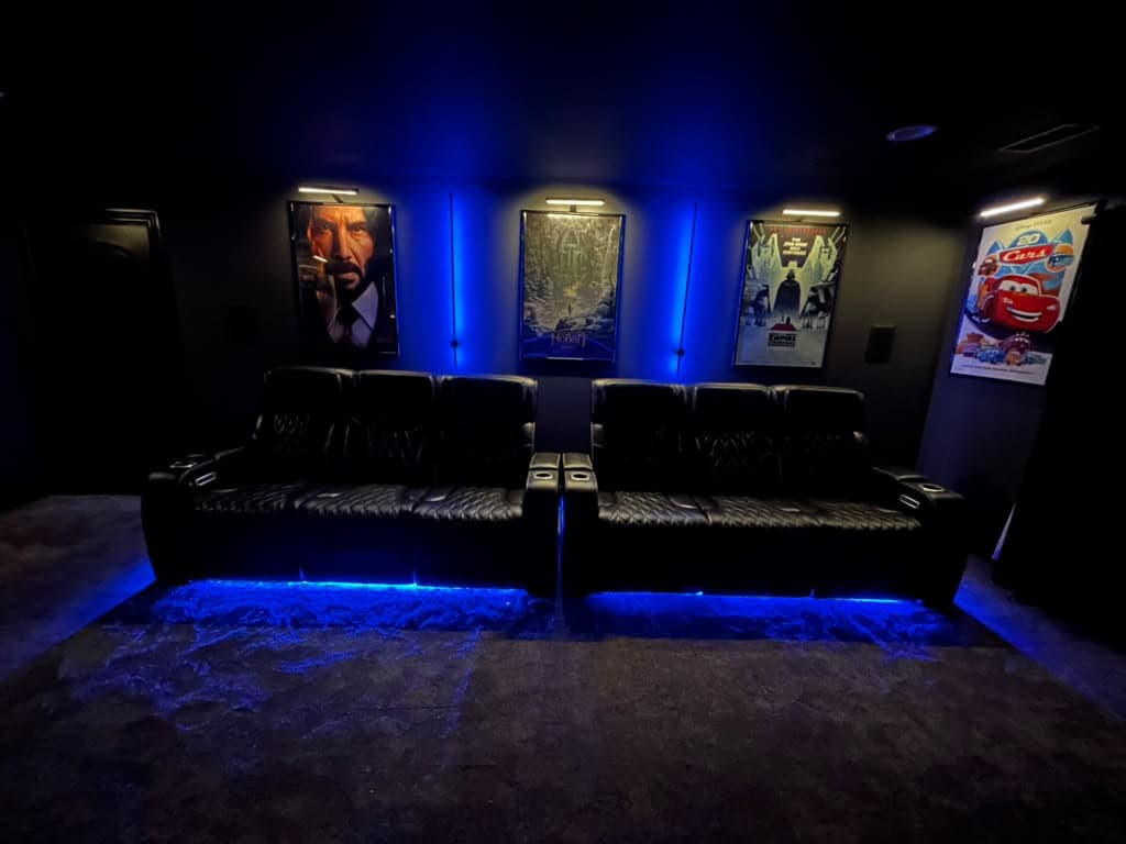 Home theater room with leather recliners, LED floor lighting and backlit framed movie posters, Nashville TN